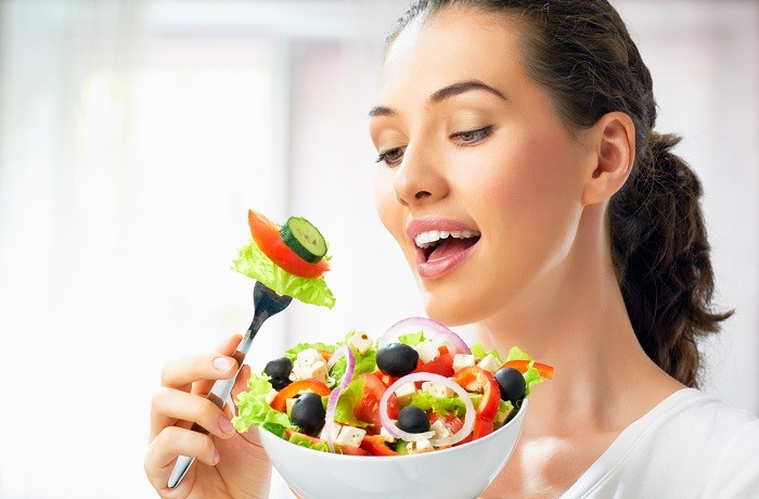 girl-woman-plate-fork-salad-vegetables-charm-cucumbers-olives-onions-cheese-tomatoes
